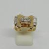 Bague en or bicolore, modèle structuré, saphirs blancs, vers 1925.