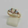 Bague en or rosé, demi-perles fines et cabochons d'opales, vers 1890-1900.