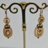 Boucles d'oreilles en or rosé, pendantes avec demi-perles fines, vers 1870. – Image 2