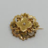 Broche en or rosé et vert, ajourée et demi-perle fine, vers 1880.