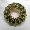 Broche laiton, ronde et pavage de strass de couleur vert différents, 1940-50.