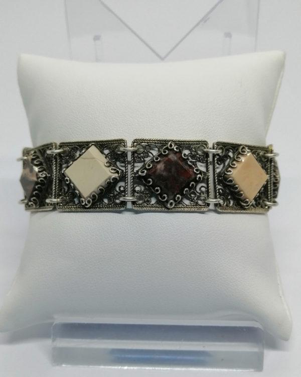 Bracelet argent/vermeil, avec maillons filigranés et sertie de pierres naturelles, vers 1930.