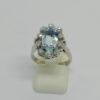 Bague en or gris, sertie de diamants taillés et d'une aigue-marine facettée, vers 1950.